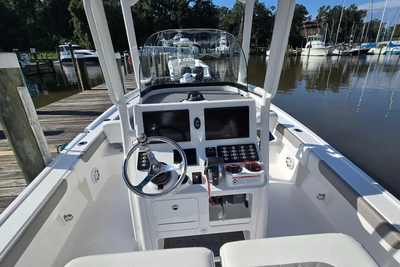 Slide: The Image of 2022 Caymas 28 HB boat with Mercury 400 engine docked in marina. - 15