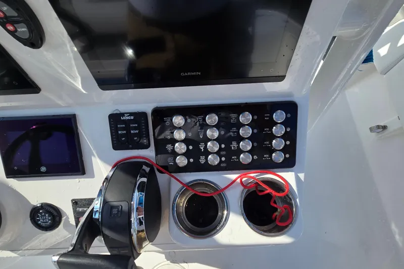 Slide: The Image of 2022 Caymas 28 HB boat interior with control panel and portable toilet. - 21