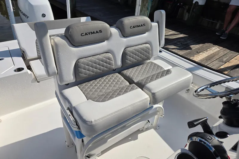 Slide: The Image of Control panel of 2022 Caymas 28 HB boat with Garmin displays and steering wheel. - 23