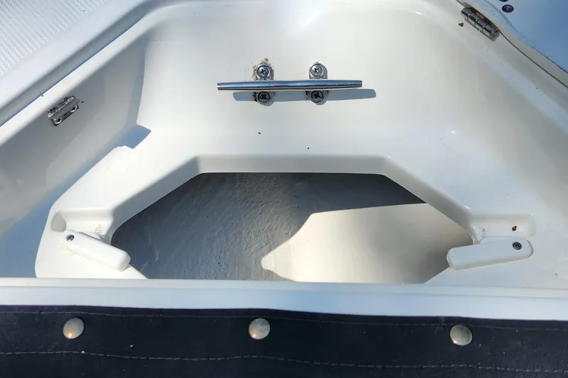 Slide: The Image of 2012 Key West 211 DC boat storage compartment with cleat and latch. - 13