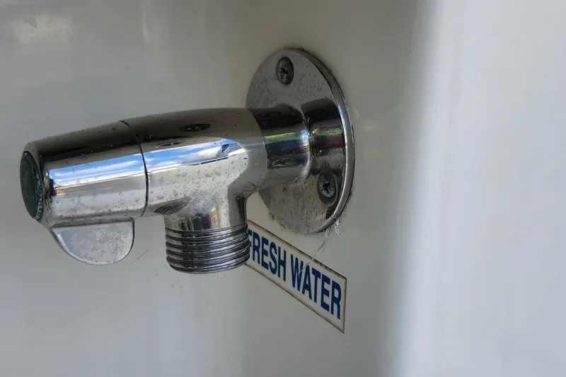 Slide: The Image of Chrome faucet labeled "Fresh Water" on 2012 Key West 211 DC boat. - 21