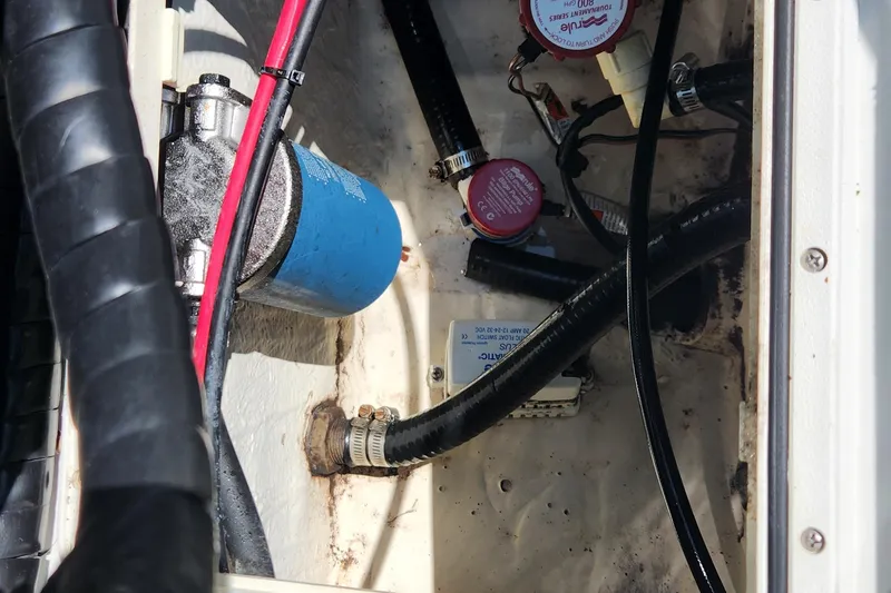 Slide: The Image of Boat engine compartment with cables and components, Key West 211 DC, 2012 model. - 23