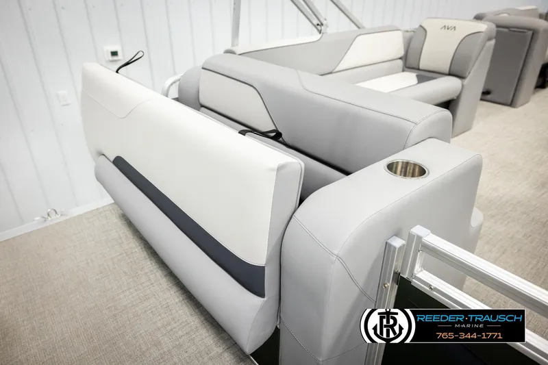 Slide: The Image of 2026 Avalon VEN CRB boat interior with gray seating and cup holder, Reeder-Trausch Marine logo. - 22