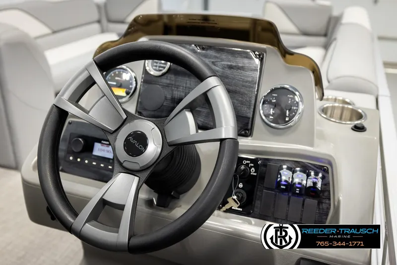 Slide: The Image of Steering wheel and dashboard of 2026 Avalon VEN CRB boat, featuring modern controls and gauges. - 26