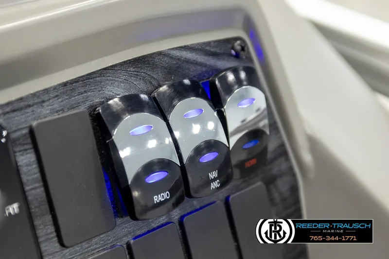 Slide: The Image of Control panel of 2026 Avalon VEN CRB with illuminated switches for radio, navigation, and horn. - 32