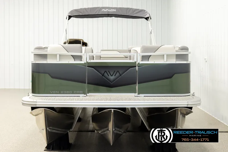 Slide: The Image of 2026 Avalon VEN CRB pontoon boat in showroom, featuring sleek design and modern amenities. - 7