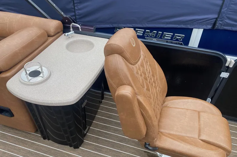 Slide: The Image of Luxurious seating and table setup on 2022 Premier 270 Intrigue RF boat. - 8
