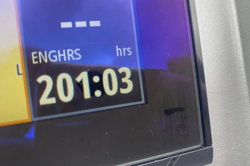 Slide: The Image of Engine hours display showing 201:03 on a 2022 Premier 270 Intrigue RF. - 9