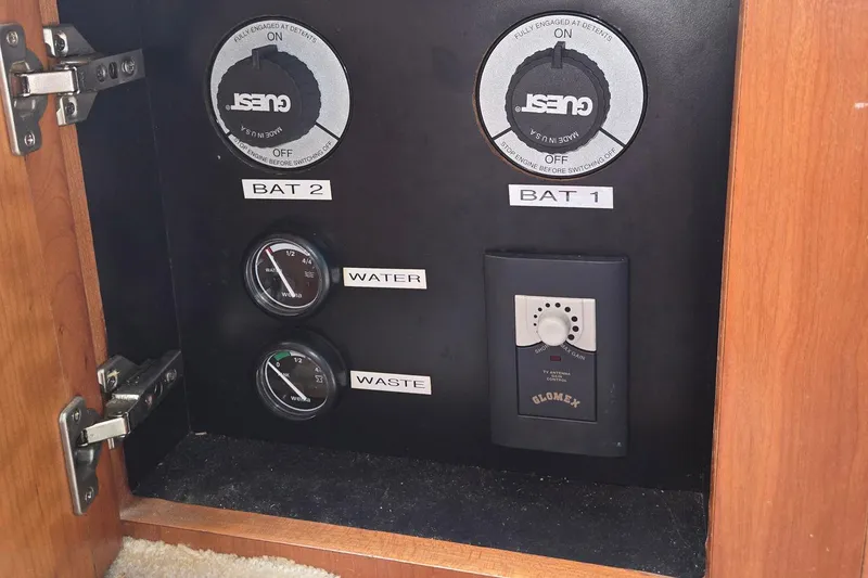 Slide: The Image of Control panel of a 2003 Silverton 392 Motor Yacht with battery and gauge indicators. - 10