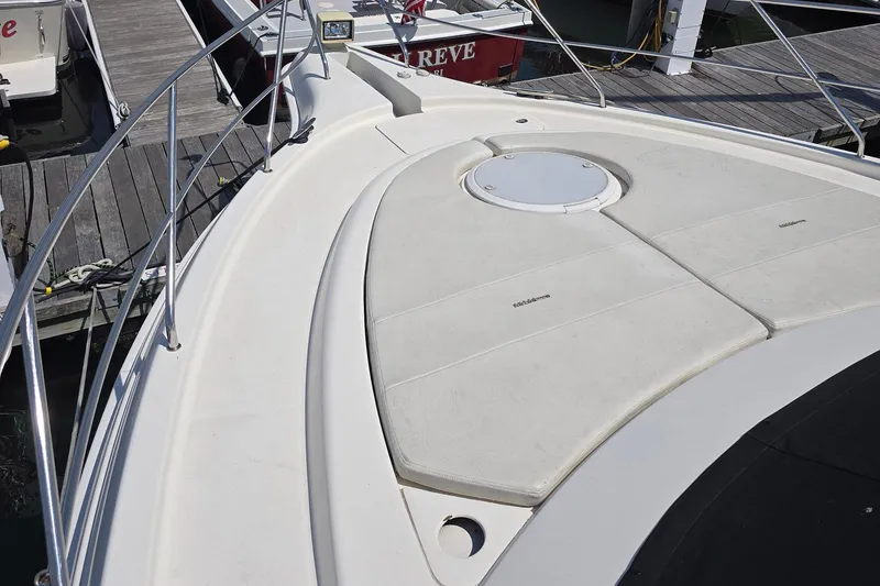 Slide: The Image of 2003 Silverton 392 Motor Yacht bow with sunpad and dock view. - 17
