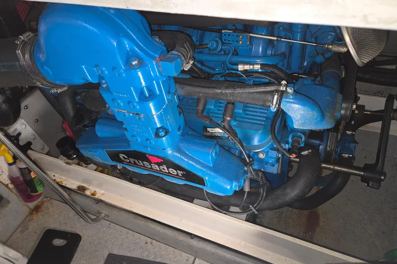 Slide: The Image of Engine compartment of a 2003 Silverton 392 Motor Yacht with a blue Crusader engine. - 32