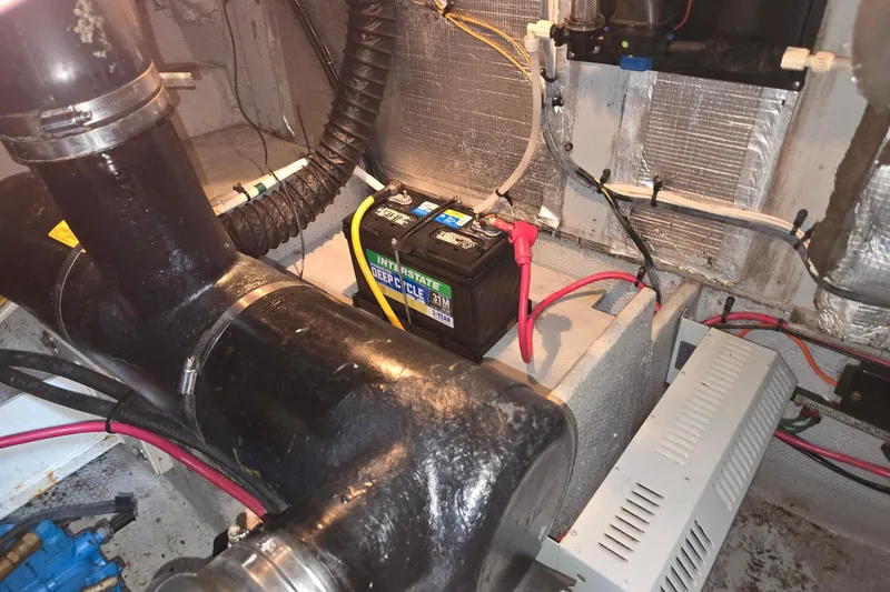 Slide: The Image of Engine room of 2003 Silverton 392 Motor Yacht with battery and wiring. - 34