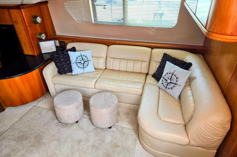 Slide: The Image of Luxurious interior of 2003 Silverton 392 Motor Yacht with beige leather seating and nautical decor. - 4