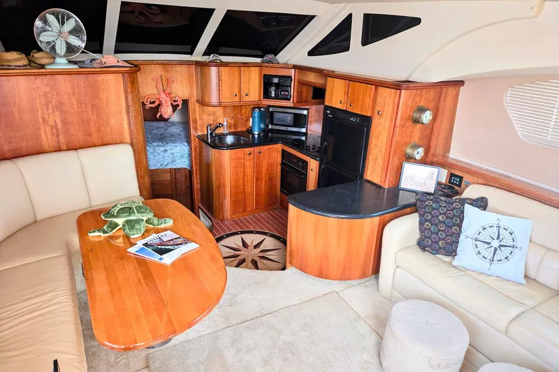 Slide: The Image of Luxurious interior of 2003 Silverton 392 Motor Yacht with cozy seating and kitchenette. - 8