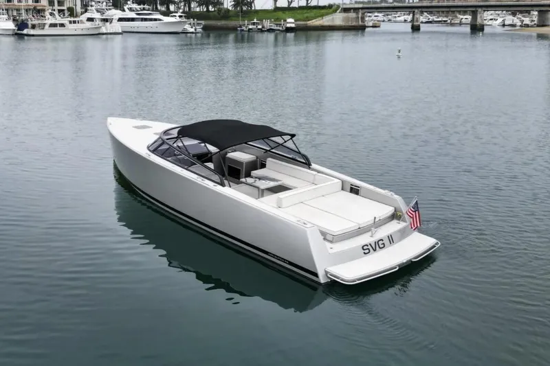 Slide: The Image of 2016 VanDutch CRUISER yacht with sleek design, docked in a serene marina. - 0