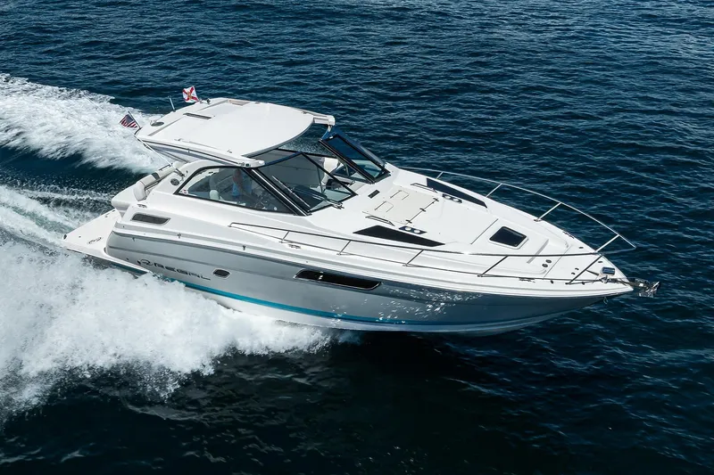 The Image of 2020 Regal 35 Sport Coupe cruising on open water, showcasing sleek design and performance. - 0