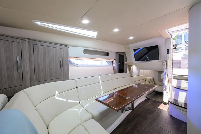 Slide: The Image of Luxurious interior of 2020 Regal 35 Sport Coupe with modern seating and wooden table. - 20