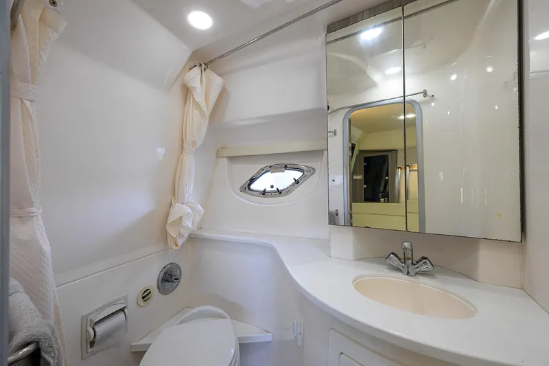 Slide: The Image of 2020 Regal 35 Sport Coupe bathroom with modern fixtures and mirrored cabinet. - 28