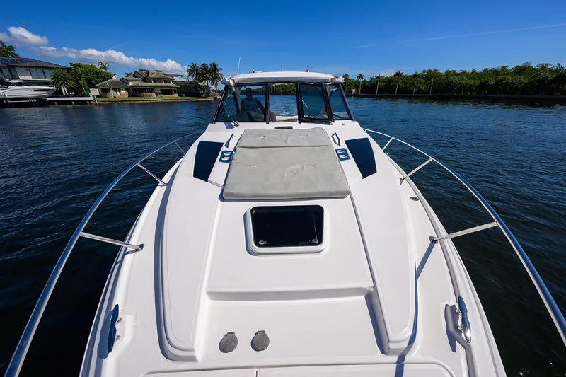 Slide: The Image of 2020 Regal 35 Sport Coupe cruising on a sunny day, showcasing sleek design and luxury. - 31