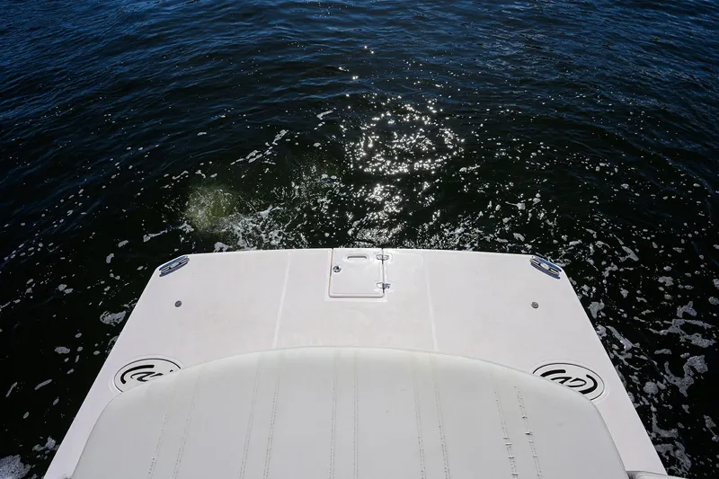 Slide: The Image of 2020 Regal 35 Sport Coupe boat deck overlooking sparkling water. - 36