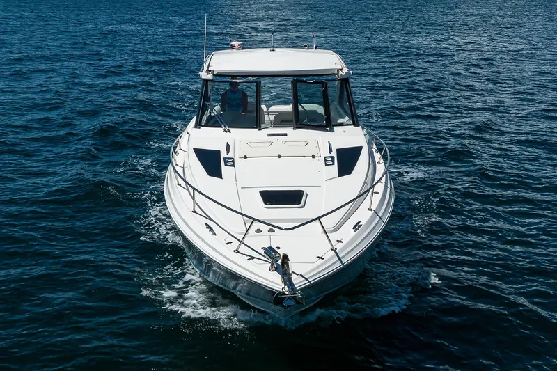 Slide: The Image of 2020 Regal 35 Sport Coupe cruising on open water, front view. - 39