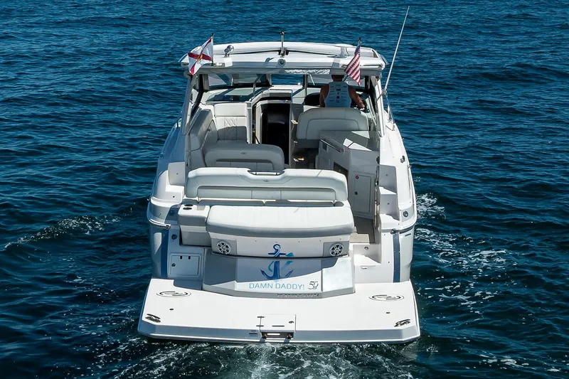 Slide: The Image of 2020 Regal 35 Sport Coupe cruising on open water, rear view. - 42