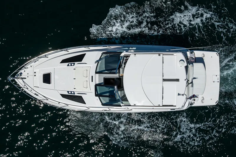 Slide: The Image of Overhead view of 2020 Regal 35 Sport Coupe cruising on water. - 44