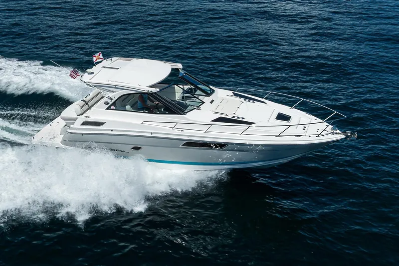 Slide: The Image of 2020 Regal 35 Sport Coupe cruising on open water, showcasing sleek design and performance. - 45