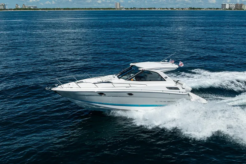 Slide: The Image of 2020 Regal 35 Sport Coupe cruising on open blue water. - 48