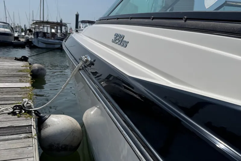 Slide: The Image of 2014 Monterey 328 Super Sport boat docked at marina with fenders. - 18