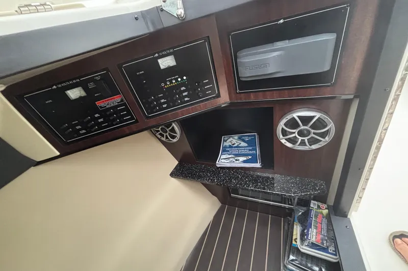 Slide: The Image of Control panel of a 2014 Monterey 328 Super Sport boat interior. - 24