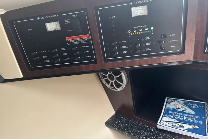 Slide: The Image of Control panel of a 2014 Monterey 328 Super Sport boat with manuals. - 26