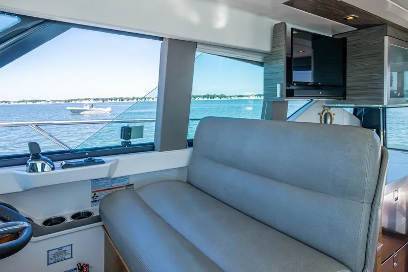 Slide: The Image of Interior of 2020 Tiara Yachts C44 Coupe with scenic water view. - 103