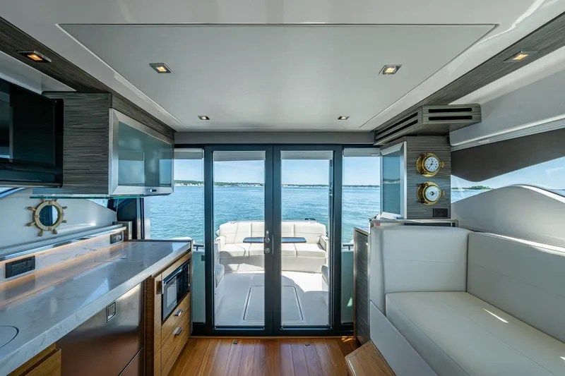 Slide: The Image of Interior of 2020 Tiara Yachts C44 Coupe with modern design and ocean view. - 105