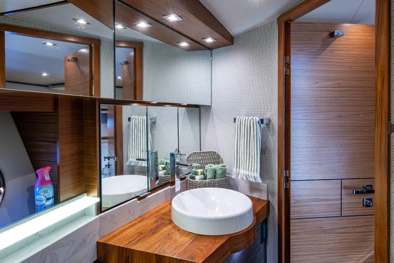 Slide: The Image of Luxurious bathroom interior of 2020 Tiara Yachts C44 Coupe with modern fixtures and wooden accents. - 49