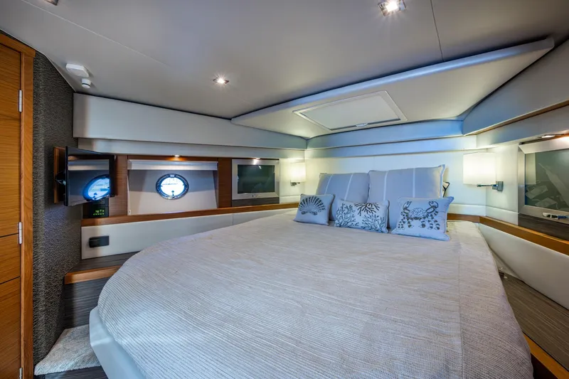 Slide: The Image of Luxurious bedroom interior of 2020 Tiara Yachts C44 Coupe with elegant decor. - 52