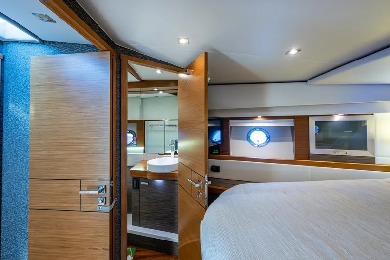 Slide: The Image of Luxurious interior of 2020 Tiara Yachts C44 Coupe, featuring a modern bedroom and bathroom. - 53