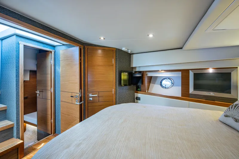 Slide: The Image of Luxurious interior of 2020 Tiara Yachts C44 Coupe with wood finishes and modern amenities. - 54