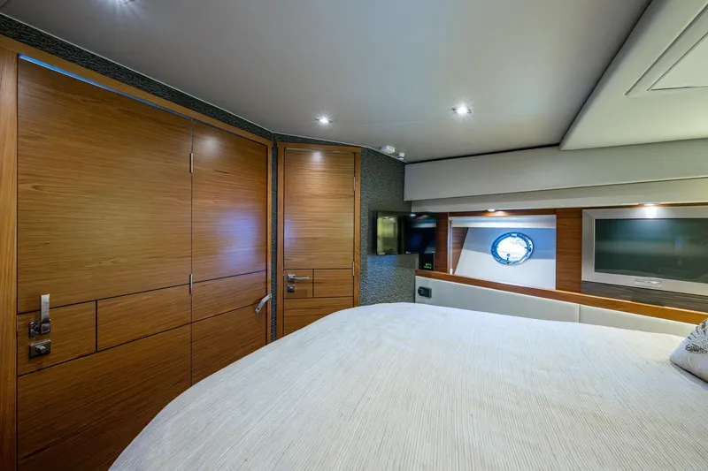 Slide: The Image of Luxurious interior of 2020 Tiara Yachts C44 Coupe with wood paneling and modern amenities. - 55