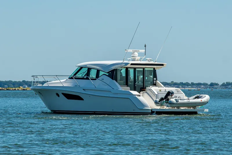 Slide: The Image of 2020 Tiara Yachts C44 Coupe cruising on open water. - 67