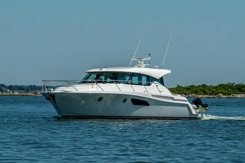 Slide: The Image of 2020 Tiara Yachts C44 Coupe cruising on open water. - 72