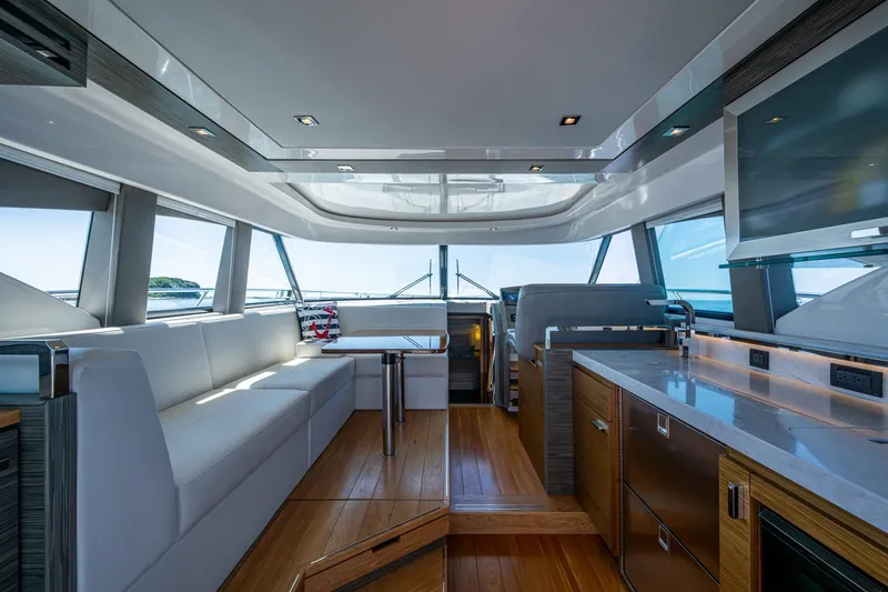 Slide: The Image of Luxurious interior of 2020 Tiara Yachts C44 Coupe with modern design and panoramic windows. - 94