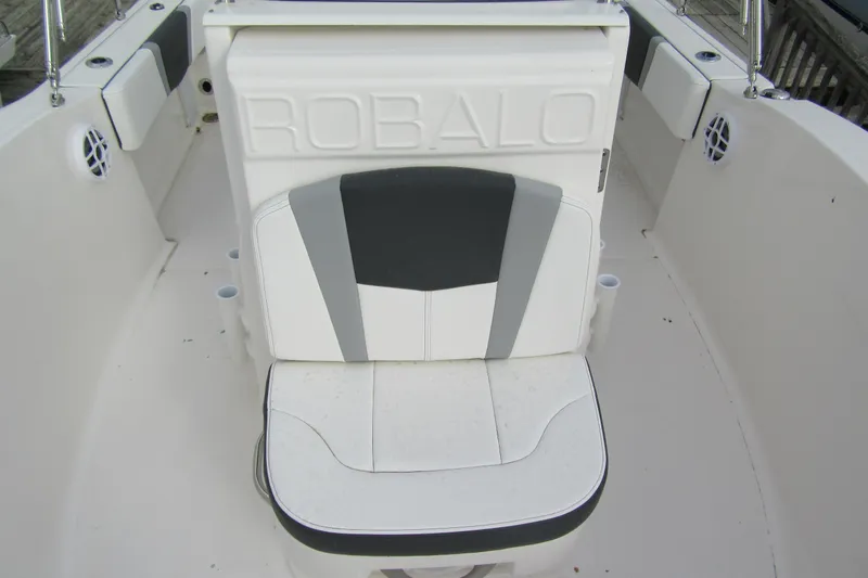 Slide: The Image of 2026 Robalo R180 Center Console boat seat with white and gray upholstery. - 10