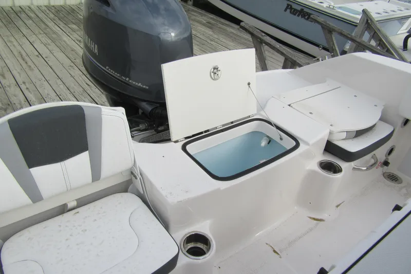 Slide: The Image of 2026 Robalo R180 Center Console boat interior with Yamaha engine and seating. - 2