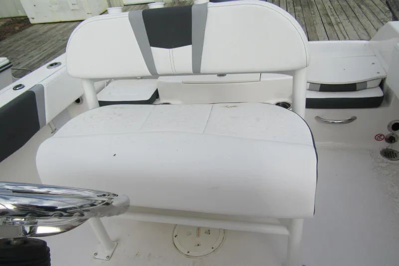 Slide: The Image of 2026 Robalo R180 Center Console boat seat with white and gray upholstery. - 5