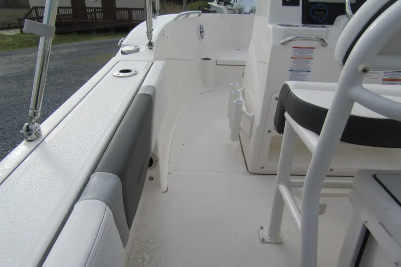 Slide: The Image of 2026 Robalo R180 Center Console boat interior with seating and console details. - 6