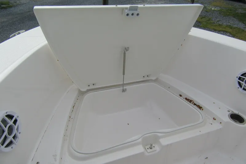 Slide: The Image of Open storage compartment on 2026 Robalo R180 Center Console boat. - 9