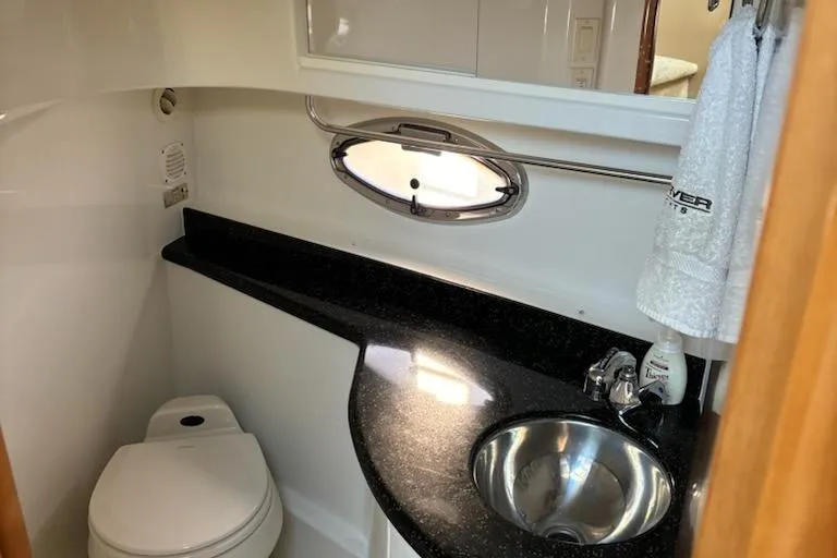 Slide: The Image of Luxurious bathroom in 2002 Carver 410 Sport Sedan yacht with sleek design. - 11