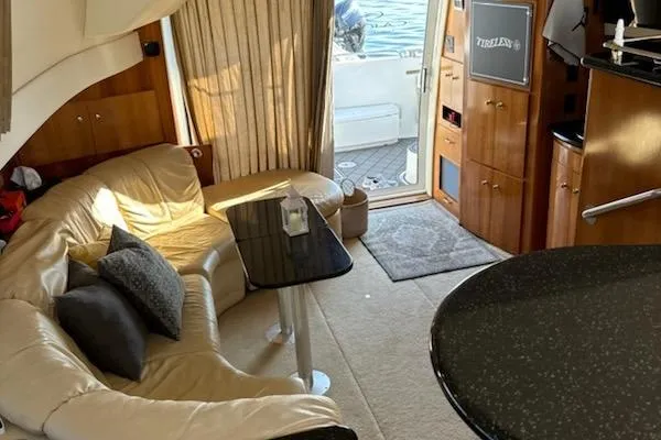 Slide: The Image of Luxurious interior of a 2002 Carver 410 Sport Sedan yacht with plush seating and elegant decor. - 2