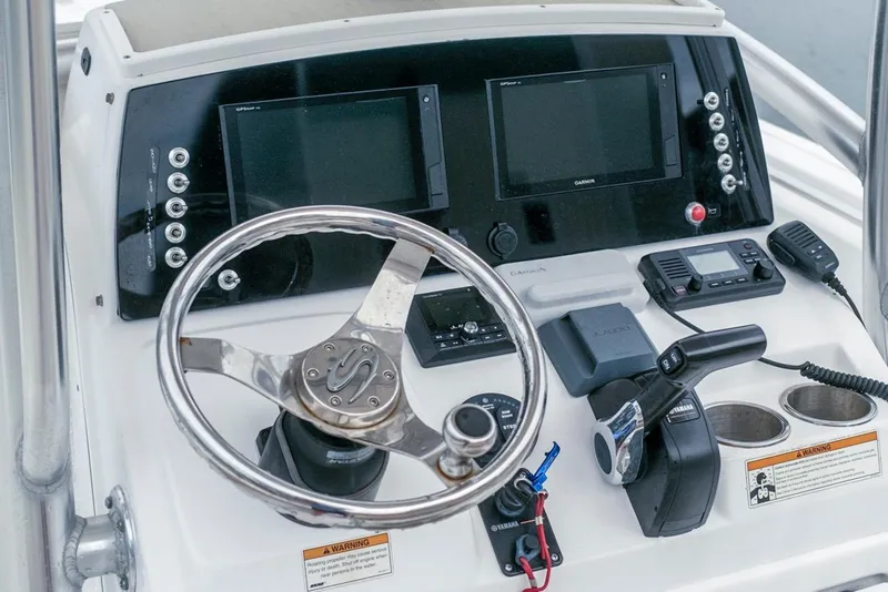 Slide: The Image of 2019 Sportsman Open 212 Center Console dashboard with steering wheel and navigation controls. - 10